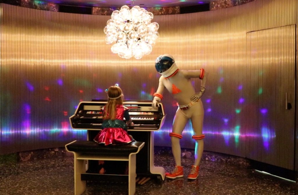 Danny Moynahan and young friend in his spaceman outfit, with a vintage organ