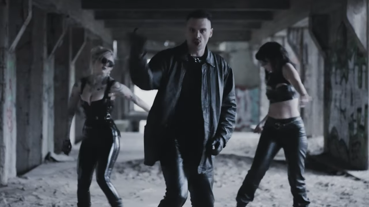 Screenshot with singer Johannes Stabel and dancers from the music video for the song "Neid," from XTR Human.